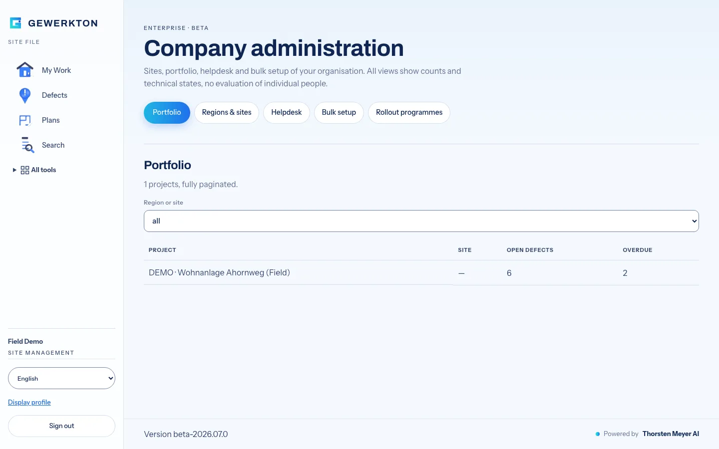 Gewerkton web app, Company administration page marked Enterprise Beta, with tabs Portfolio, Regions and sites, Helpdesk, Bulk setup and Rollout programmes, and a portfolio table filtered by region or site